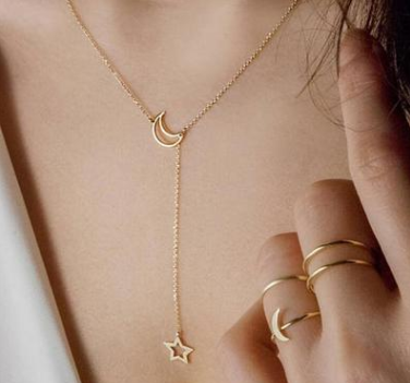 Moon and star necklace worn