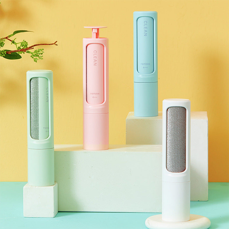 Pet hair remover brushes in green, pink, white and blue