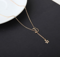 Gold moon and star necklace