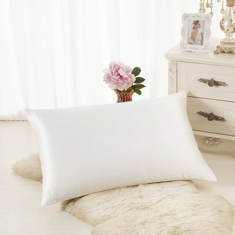 VN Satin Pillowcase on a bed, white satin