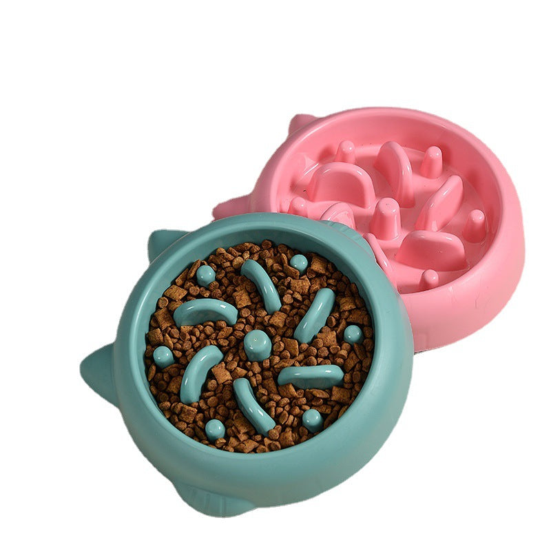 Green slow feeder bowl filled with kibble next to a pink one