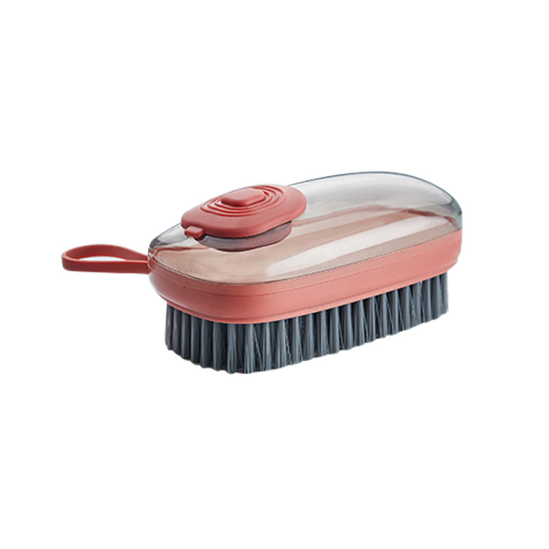 Soap-dispensing scrub brush in red