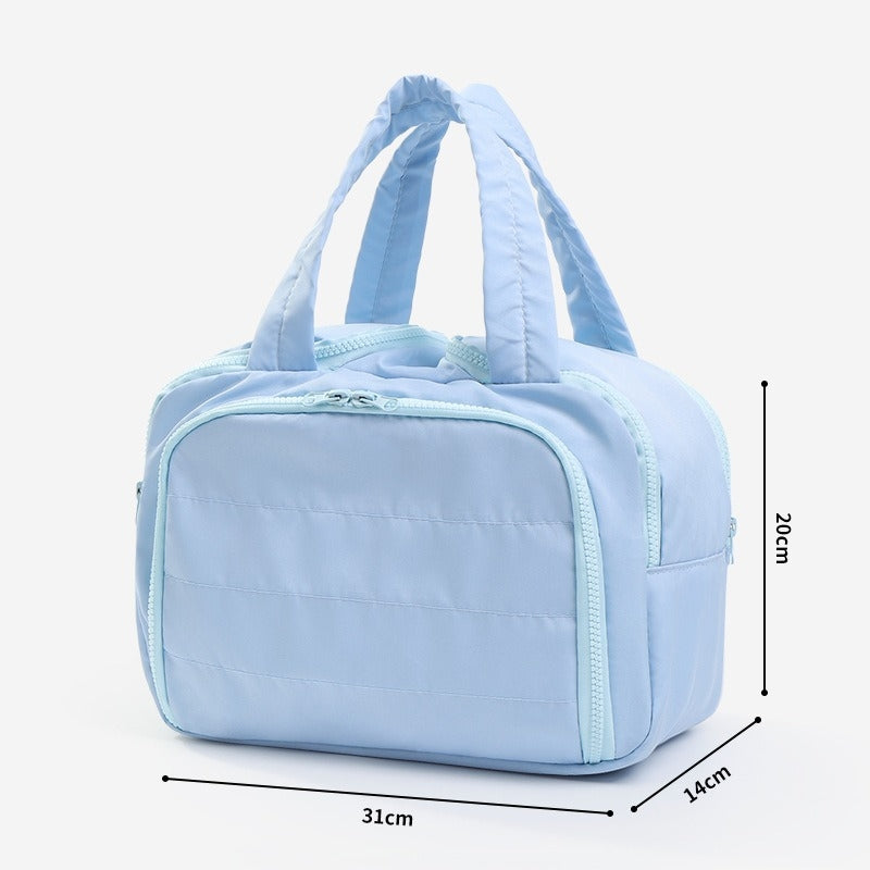 Quilted toiletry bag in blue