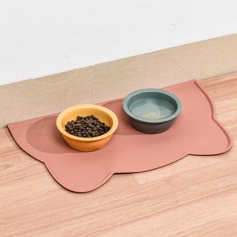 Pink silicone pet mat under two bowls