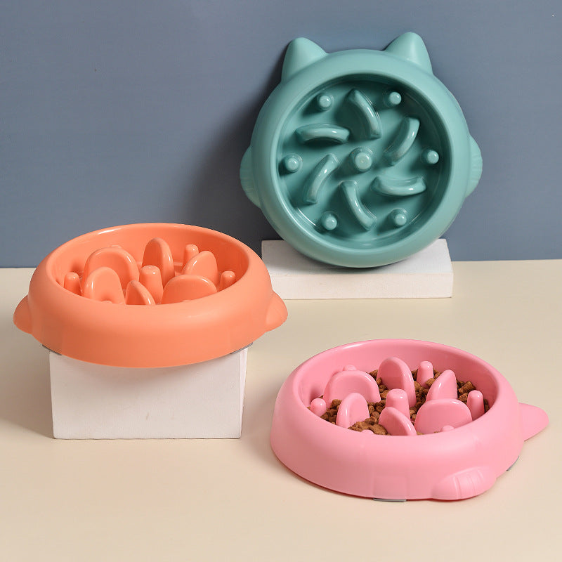 Three slow feeder bowls in green orange and pink